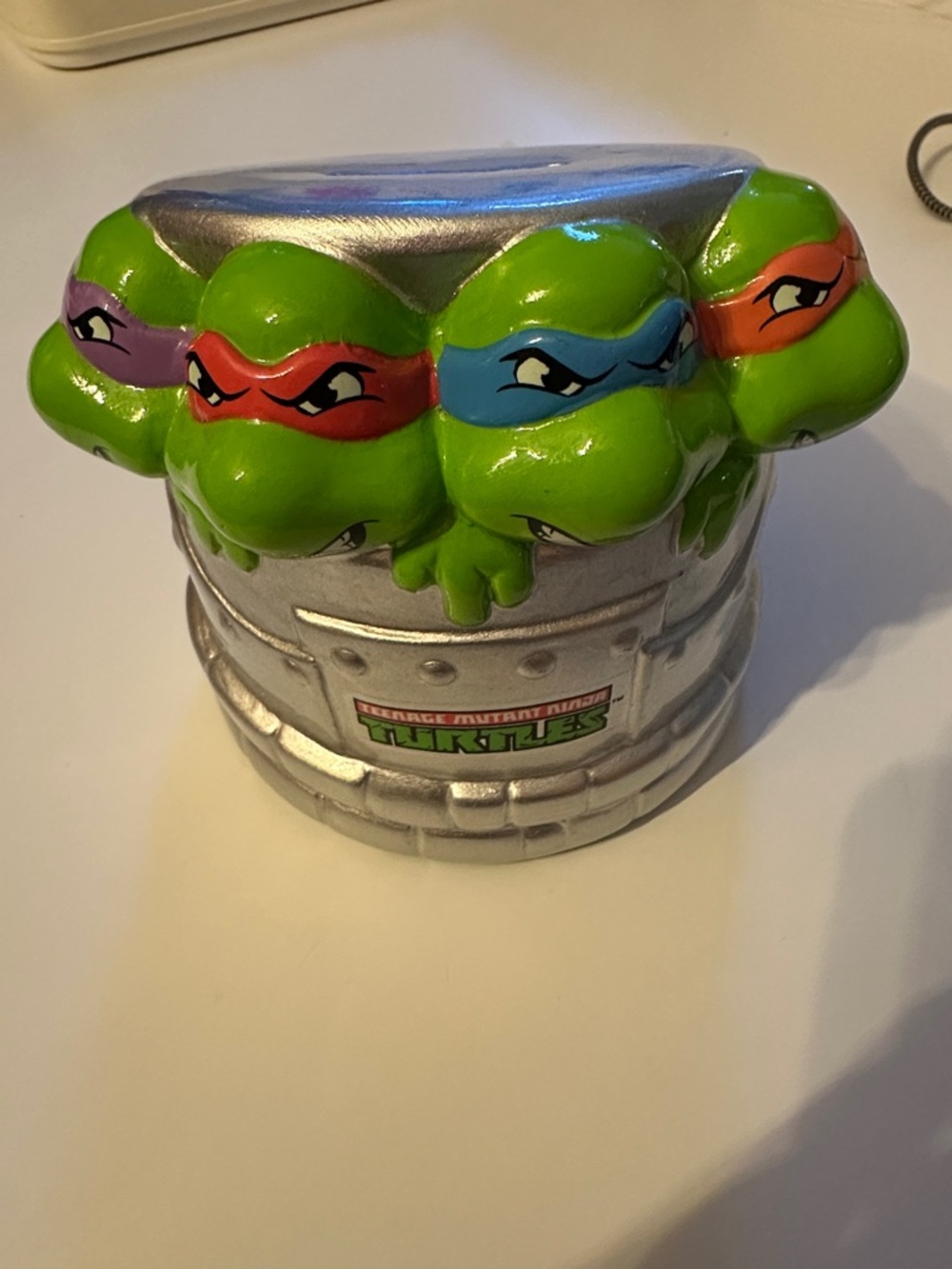 Teenage Mutant Ninja Turtles Green Piggy Bank with Colorful Masks